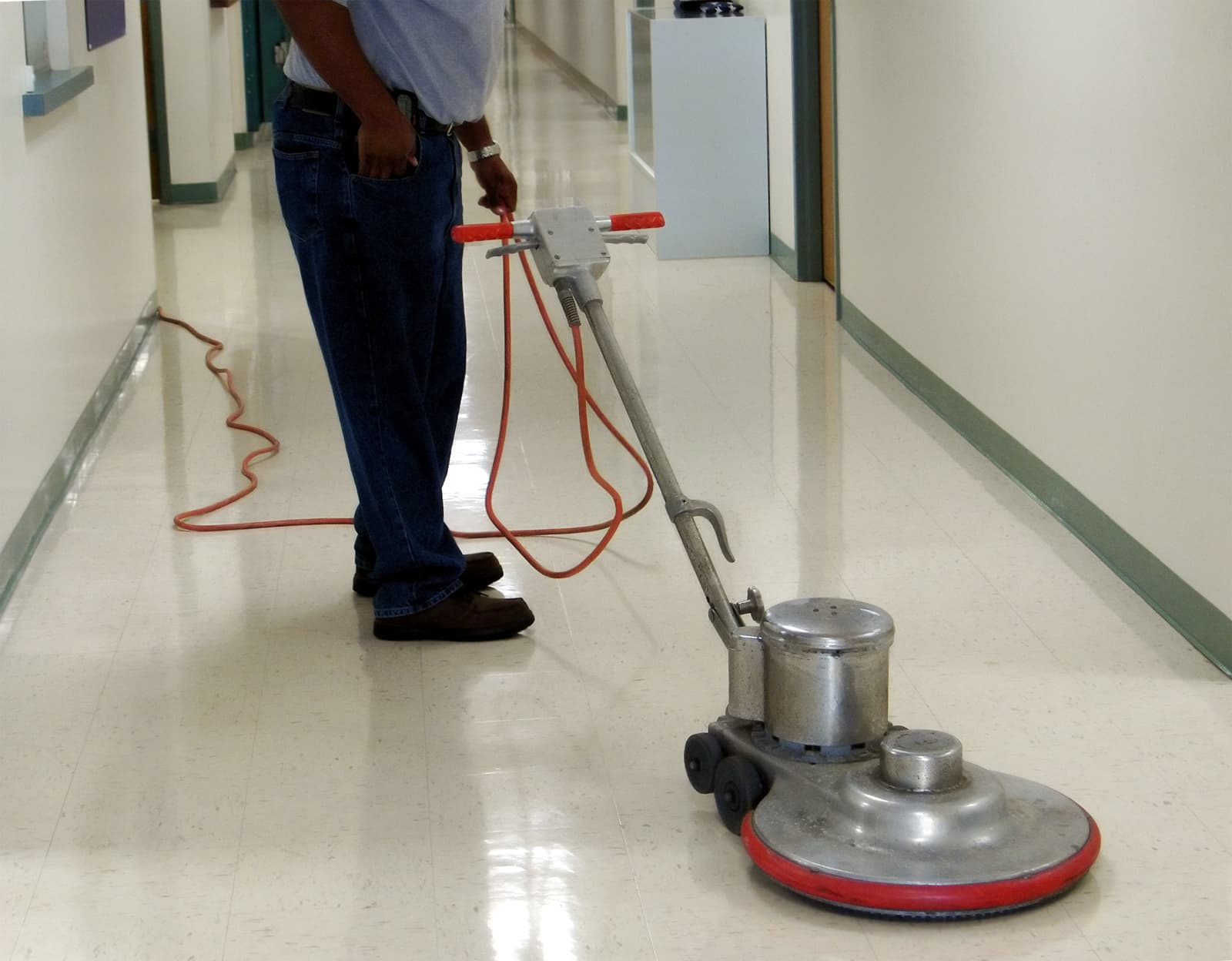 Professional pressure washing an exterior surface clean